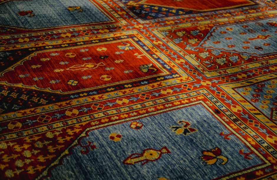 Vibrant handmade Turkish carpet with intricate patterns and rich colors. Perfect for interior decor.